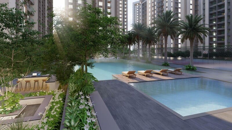 Families enjoying clubhouse, swimming pool, and sports facilities at Kolte Patil Little Earth Kiwale Pune.