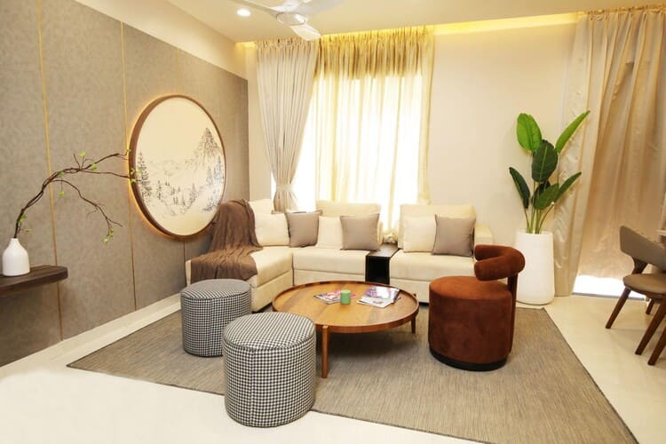 Interior of a modern 2 BHK flat in Kiwale with modular kitchen, balcony, and stylish