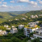 Scenic Bhugaon valley in Pune with greenery and residential apartments.