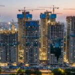 Aerial view of Pune high-rise buildings under construction using Mivan and precast technology.